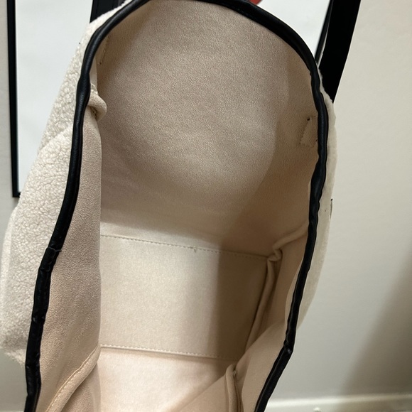 Tote Bag in cream ;Neiman Marcus
Faux Shearling Tote with makeup bag - Picture 5 of 9
